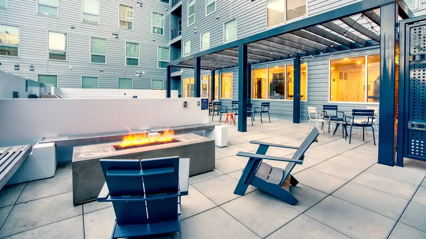 outdoor lounge featuring a fire pit